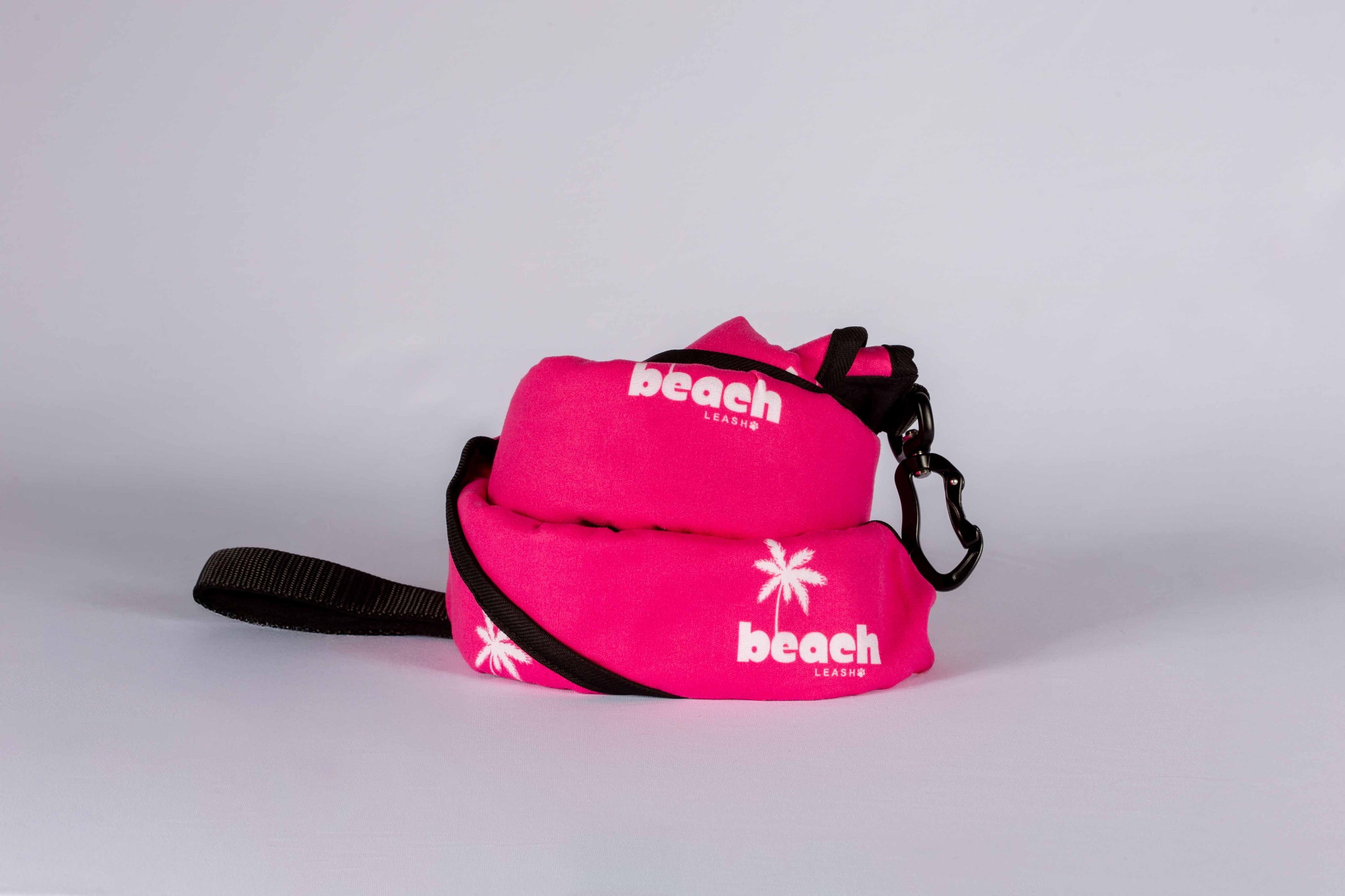 Simply Pink Beach Leash rolled up in leash mode, compact dog leash made from quick-dry towel material.